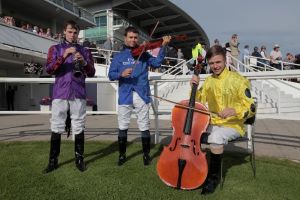 Winning Derby Jockey Swaps Reins for Strings